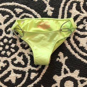 Lime green bikini bottoms with detailed sides